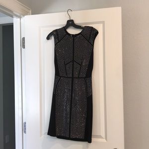 Black knit cocktail dress with rhinestone detail